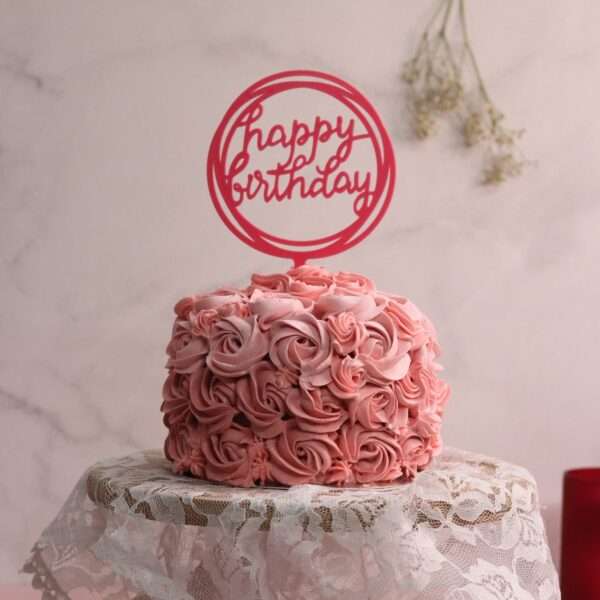Pink tall rosette cake with happy birthday topper