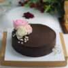 chocolate cake with pink and white roses