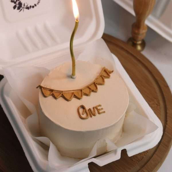 Beige bento cake with candle