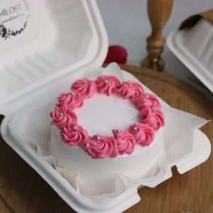 White bento cake with pink piping