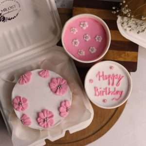 Pink bento cake with flower design and cup dessert